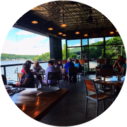 View of the patio seating at Alice's Restaurant overlooking the lake.
